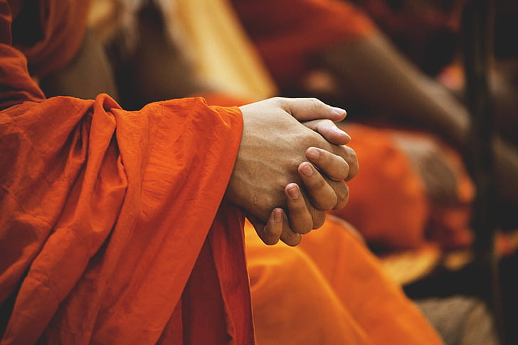monk holding his hands