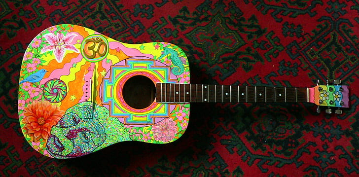 black and multicolored dreadnought acoustic guitar on textile