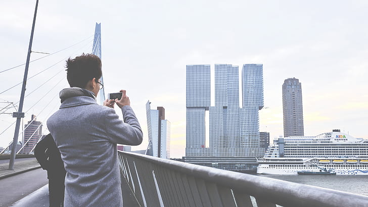 Rear View of Man Photographing Cityscape