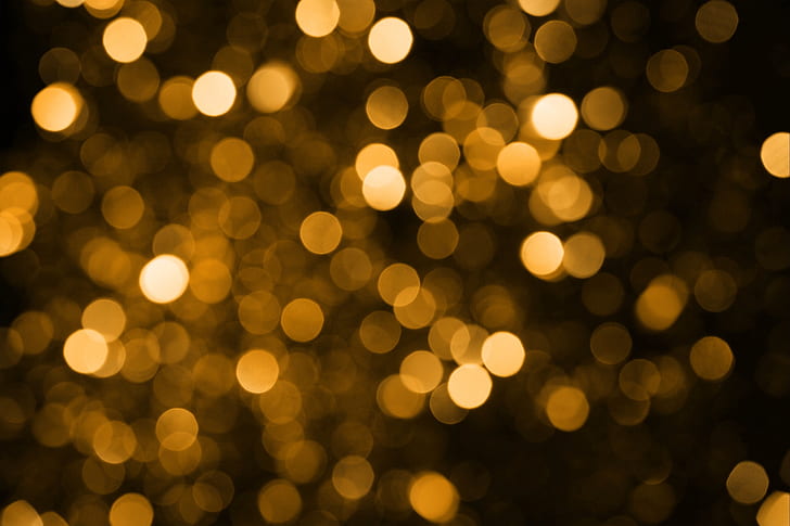 bokeh photography of brown specks of light