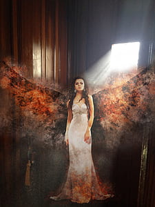 woman with burning wings standing near door