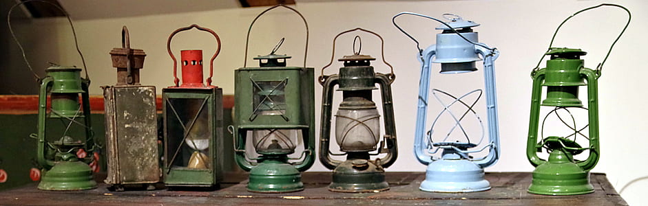 seven assorted-color lantern lamps on table