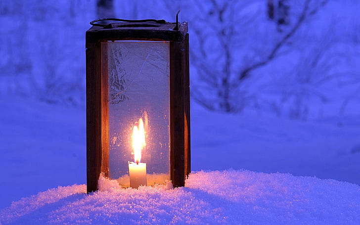 candle lantern on snow