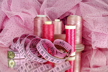 sewing thread and tape measure on ribbon