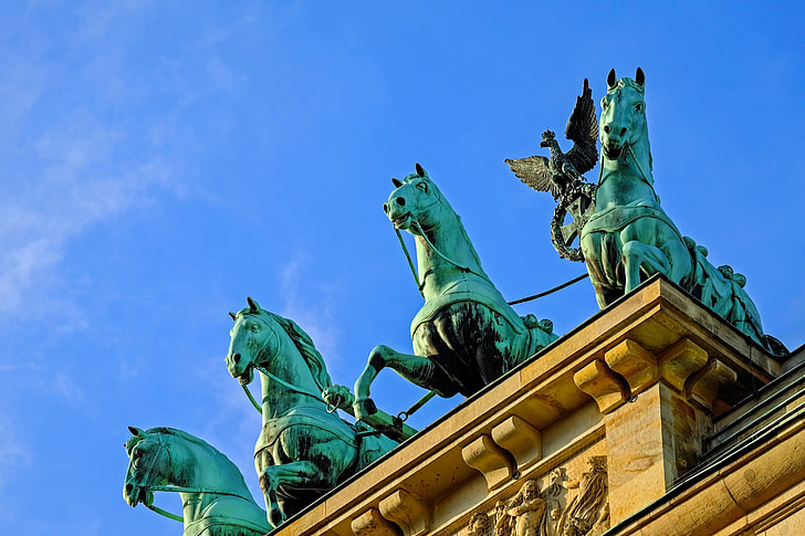 four blue horses statues