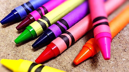 pile of assorted-color of crayons