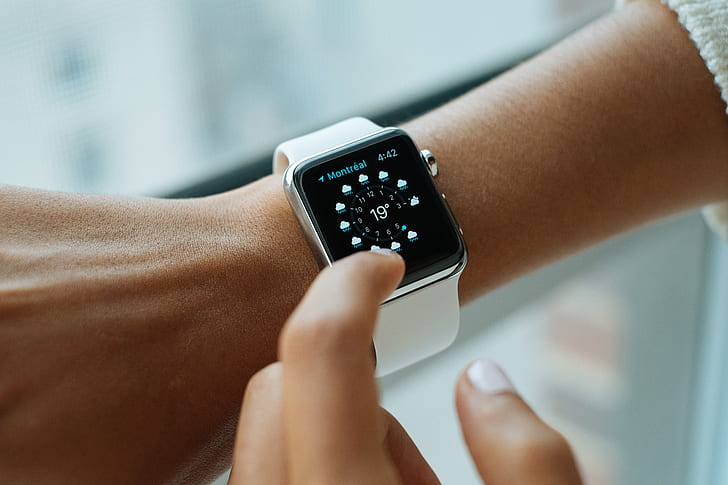 person wearing silver smartwatch