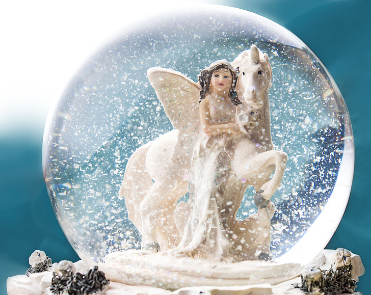 girl and white unicorn water globe