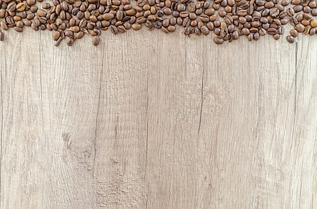 flat lay photography of coffee beans on wooden surface
