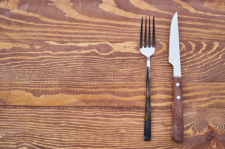silver fork and knife on table