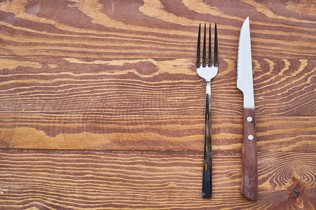 silver fork and knife on table