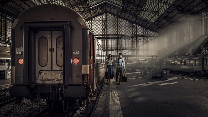 woman and man beside train photo