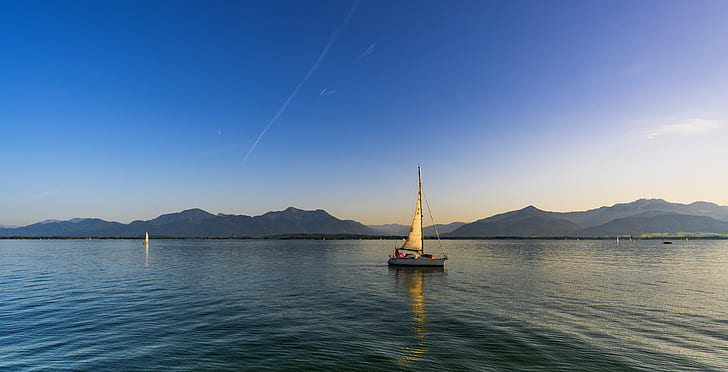 landscape photography sailboat on ocean during daytime