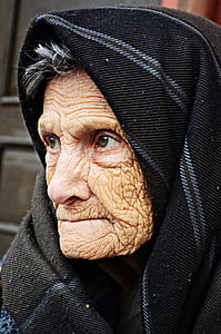 woman in black and gray headscarf
