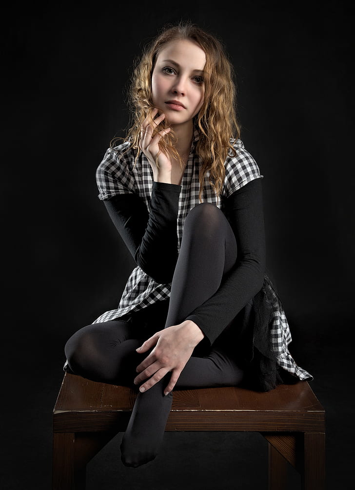 woman in white and black checkered button-up shirt