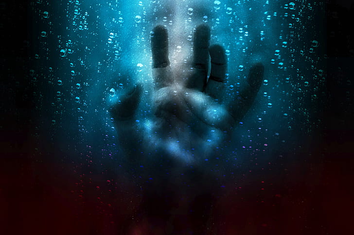 left human hand touching blue screen
