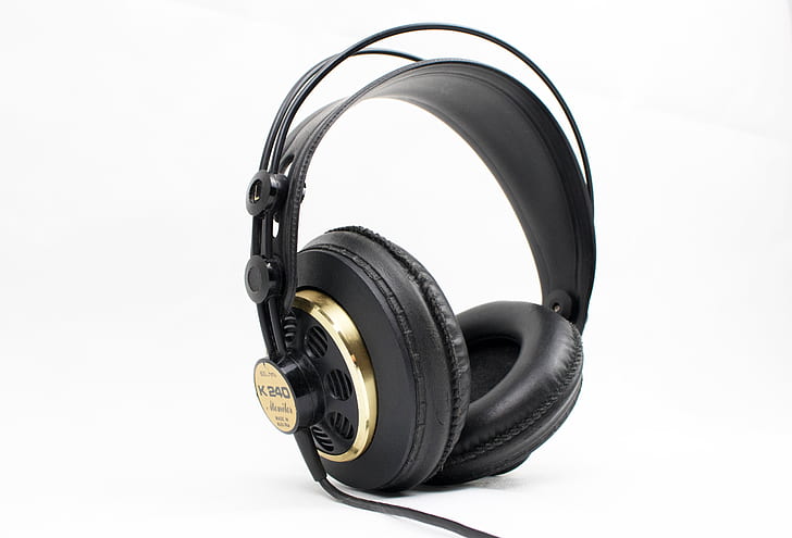 black and gold corded headphones