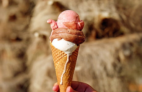 close up photography of ice cream cone during daytime