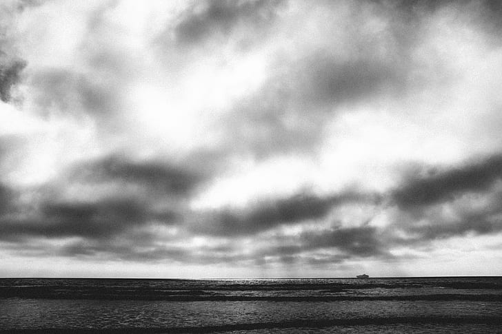 grayscale photography of sea under sky