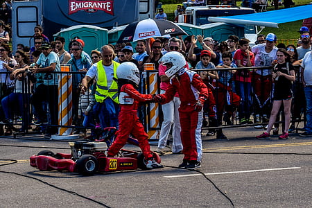 Two Boy in Red and White Racing Costume
