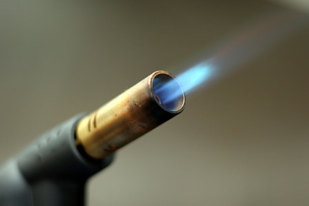 selective focus photography of torch lighter with flame