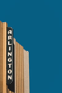 Arlington signage under blue sky during daytime