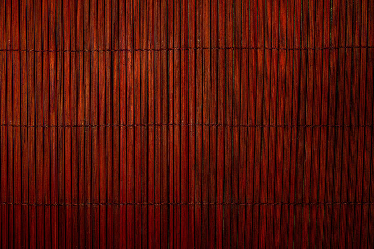 Closeup shot of a red bamboo wood texture