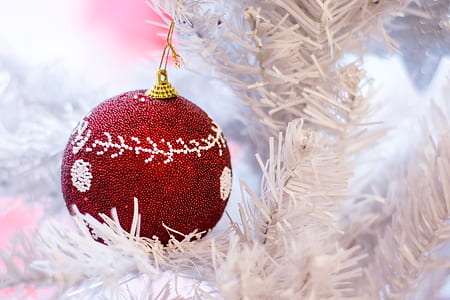 red and gray bauble hanging on white Christmas tree