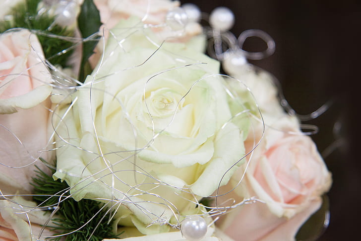 close-up photo of white and pink faux rose arrangement
