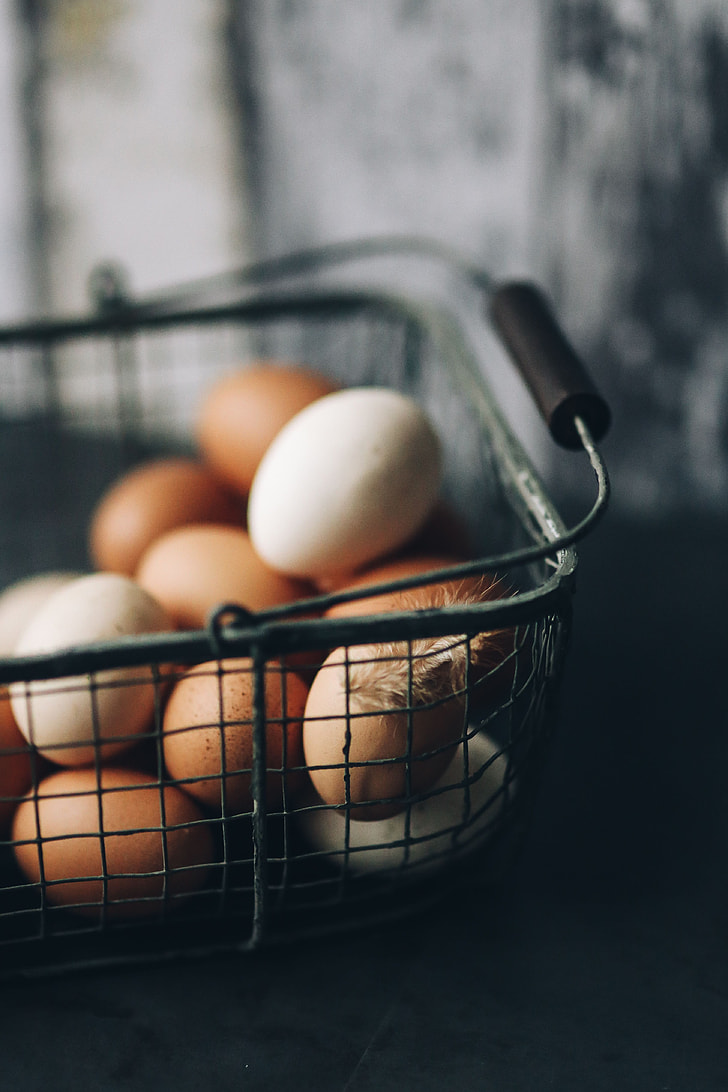 Metal wire basket with eggs