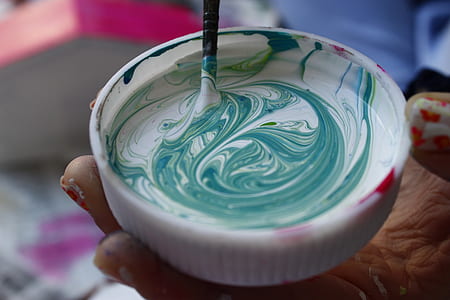 white and teal paint color on container
