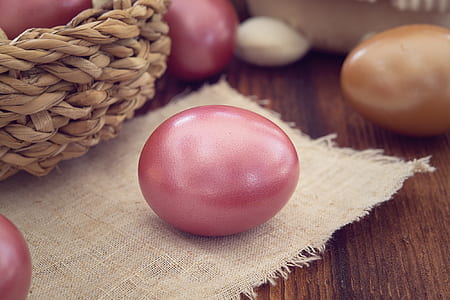 red egg on white textile