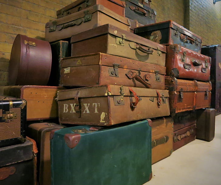 assorted-color suitcases