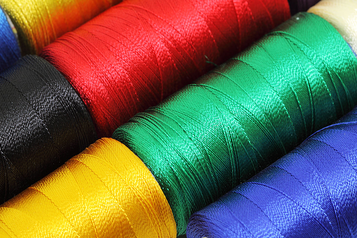 close-up photography of assorted-color threads