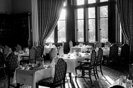 grayscale photography of dining room