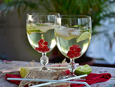 two filled clear wineglasses