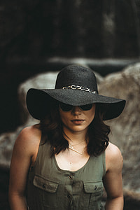 woman wearing black hat