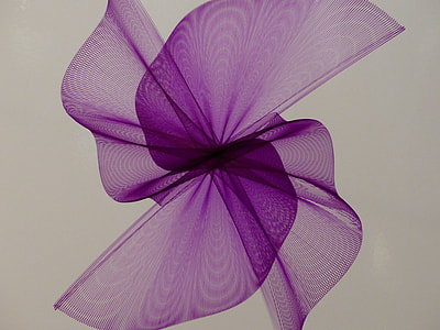 close-up photo of purple flower shape textile