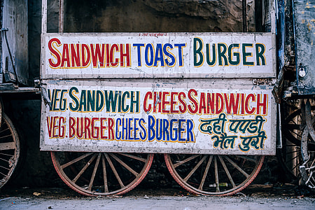 white signage on food stall