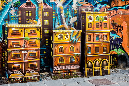 three brown buildings painted wall
