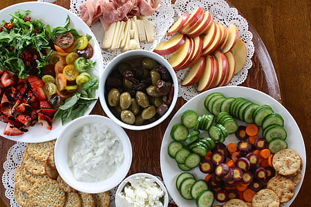sliced assorted fruits and vegetables on the table