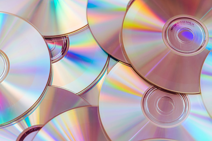 Royalty-Free photo: Pile of CDs Compact Discs and DVDs