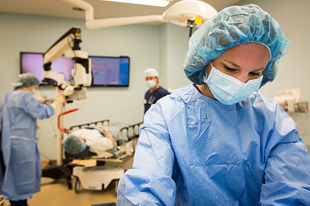woman in blue surgical suite