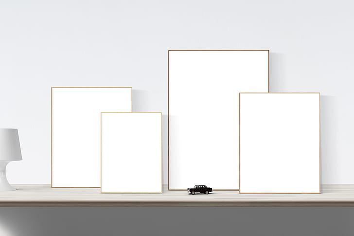 black car scale model beside rectangular white boards