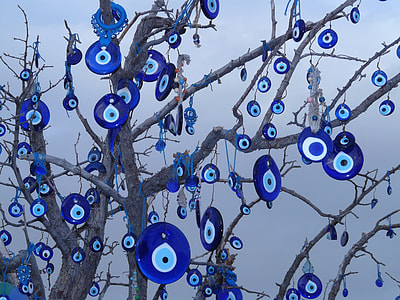 evil eye lot hanging on brown tree
