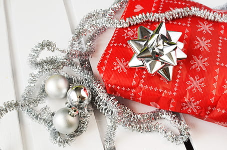 three silver Christmas baubles
