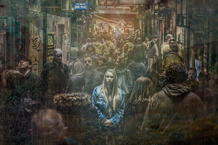 woman wearing blue denim jacket in a crowd of people