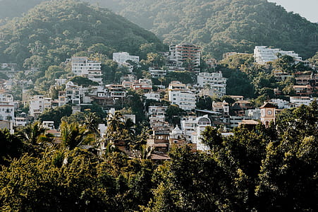 White and Brown Buildings on Mountain