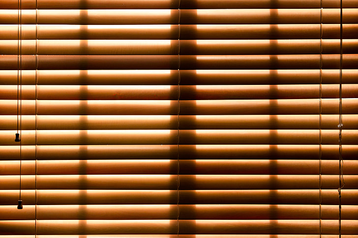 photo of brown window blinds closed