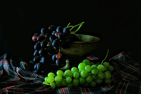 Bunches of black and green grapes